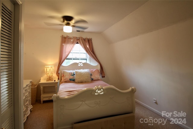 bedroom featuring ceiling fan, carpet floors, and vaulted ceiling