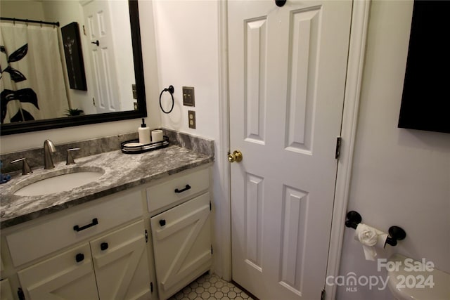 bathroom with tile patterned flooring and vanity