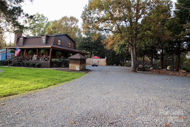 view of front facade with a front yard and a porch