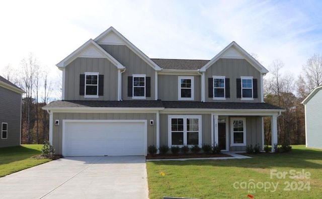 view of front facade with a front yard and a garage