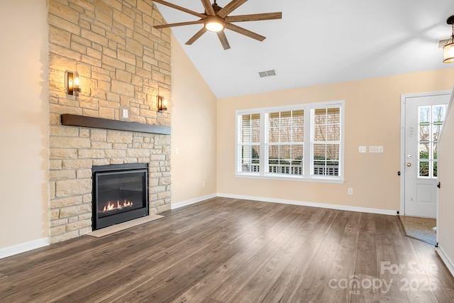 unfurnished living room featuring ceiling fan, high vaulted ceiling, dark wood-type flooring, and a fireplace