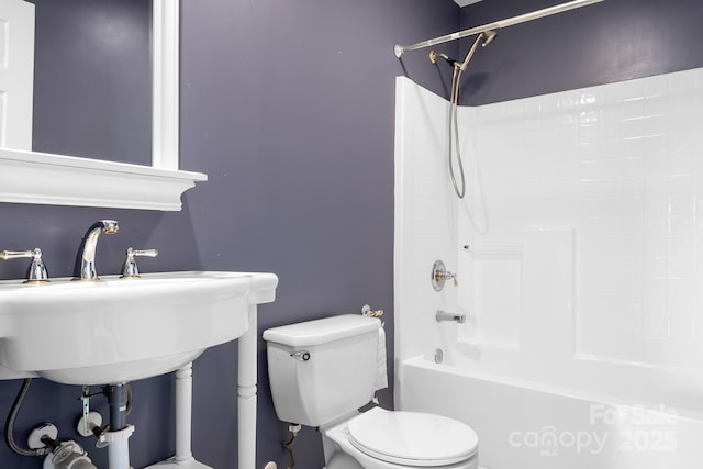 full bathroom with sink, toilet, and washtub / shower combination