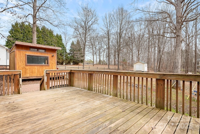 wooden deck featuring a shed