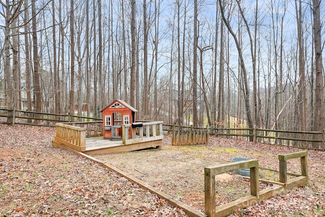 view of yard with an outbuilding and a deck