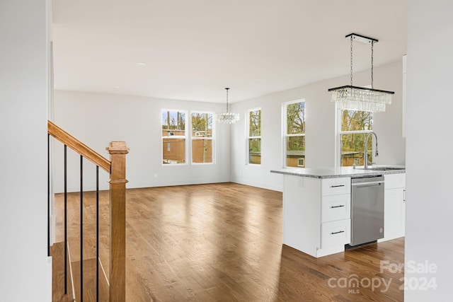 kitchen featuring white cabinetry, dishwasher, dark hardwood / wood-style floors, and sink