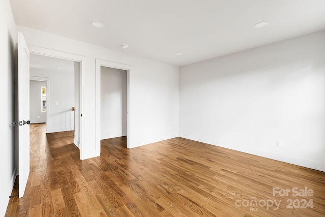 unfurnished bedroom with wood-type flooring