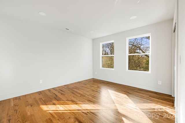 unfurnished room with light hardwood / wood-style floors