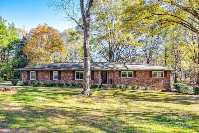 ranch-style house with a front yard