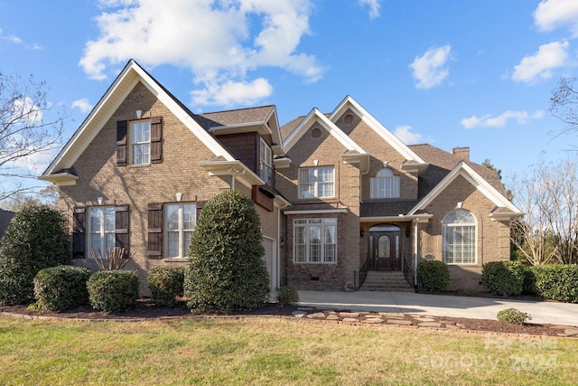 front facade with a front lawn