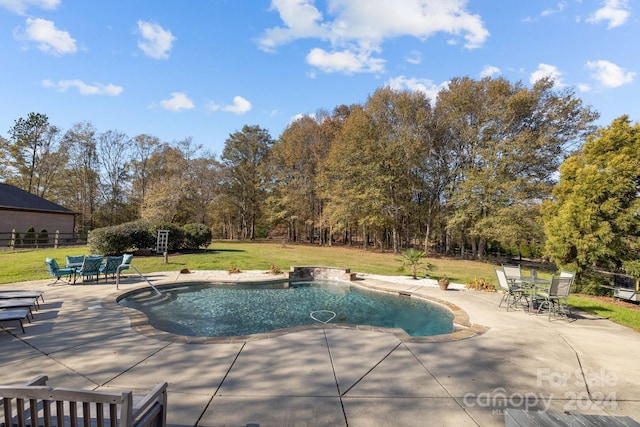 view of swimming pool with a yard and a patio