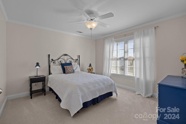 bedroom with ceiling fan, crown molding, and light carpet