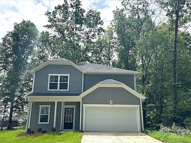 164 Wildwood Loop, Statesville, NC 28677 - traditional home with driveway, a porch, and a garage