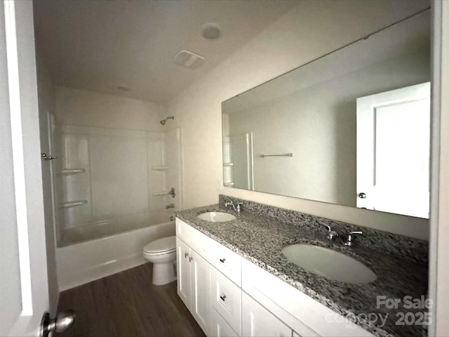 164 Wildwood Loop, Statesville, NC 28677 - full bathroom featuring wood finished floors, a sink,  shower combination, and toilet