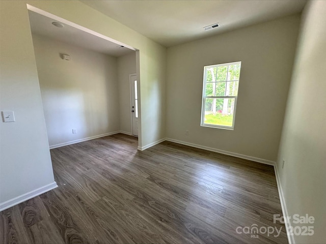 164 Wildwood Loop, Statesville, NC 28677 - spare room featuring dark wood-style floors, baseboards, and visible vents