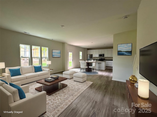 164 Wildwood Loop, Statesville, NC 28677 - living area with visible vents, dark wood-style floors, and baseboards