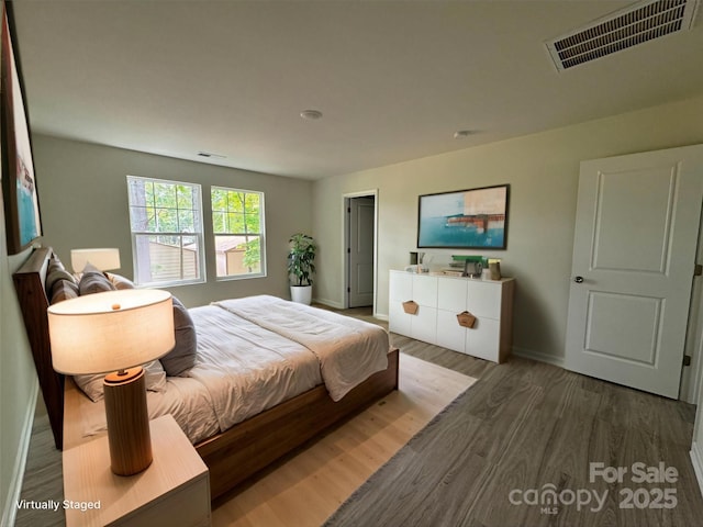 164 Wildwood Loop, Statesville, NC 28677 - bedroom with wood finished floors, visible vents, and baseboards