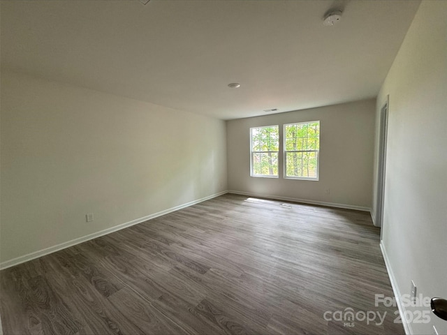 164 Wildwood Loop, Statesville, NC 28677 - spare room featuring baseboards and dark wood finished floors