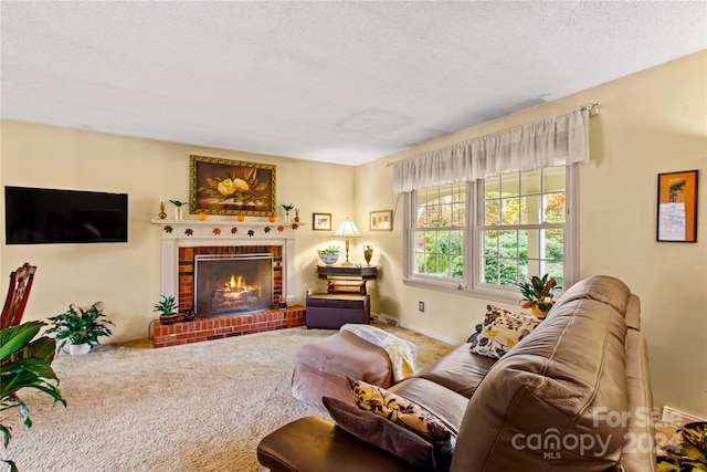 living room featuring carpet flooring, a fireplace, and a textured ceiling