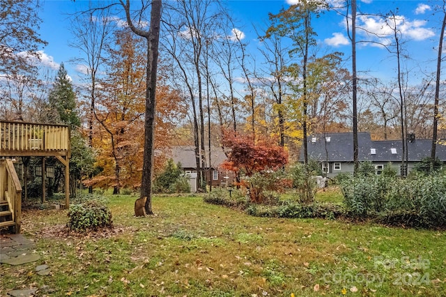 view of yard featuring a wooden deck