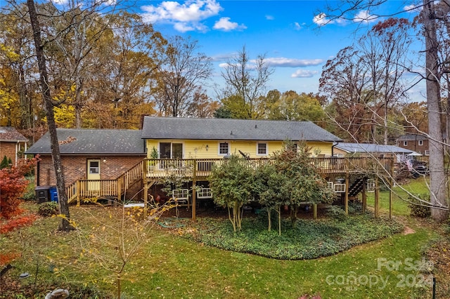 rear view of property featuring central air condition unit and a wooden deck