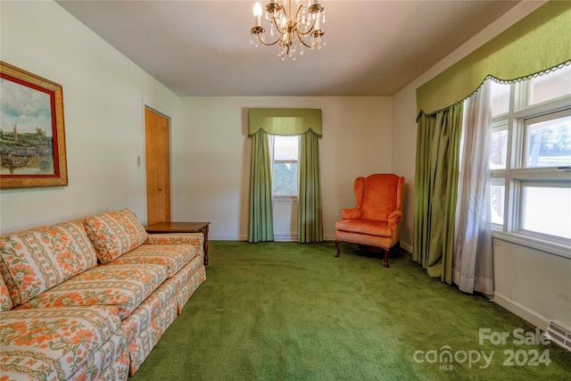 living room featuring carpet floors and a notable chandelier