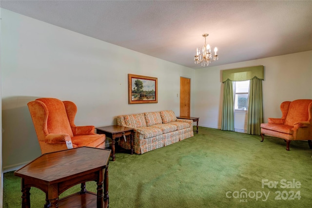 living room featuring carpet and an inviting chandelier