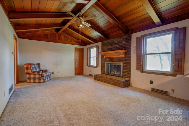 unfurnished living room with a brick fireplace, wood ceiling, carpet floors, ceiling fan, and vaulted ceiling with beams