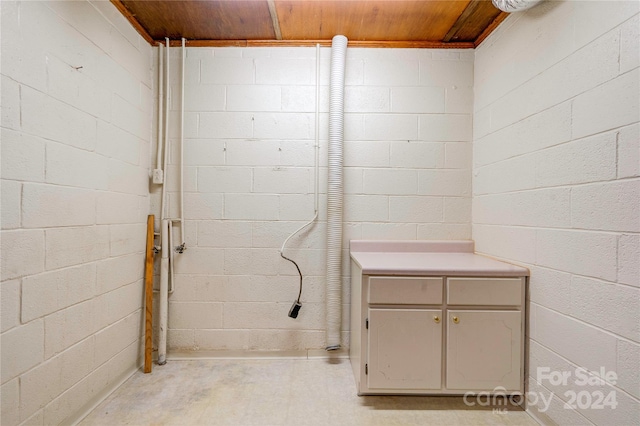 bathroom with wooden ceiling