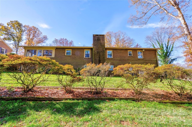 view of property exterior featuring a lawn