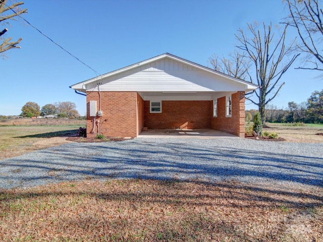 view of side of property with a carport