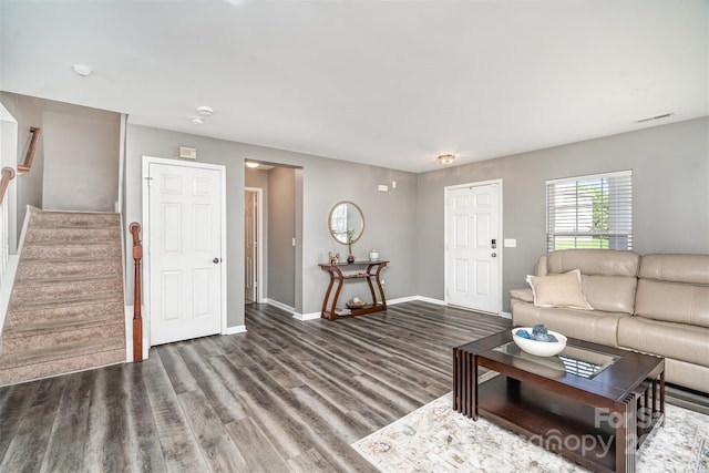 living room featuring dark wood-type flooring