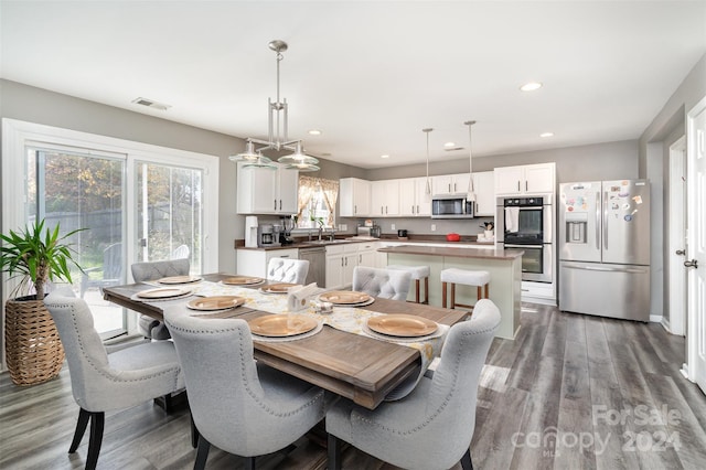 dining area featuring dark hardwood / wood-style flooring and sink