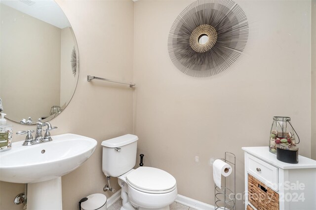 bathroom with sink and toilet