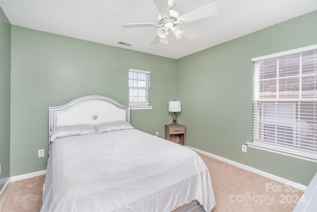 carpeted bedroom featuring ceiling fan