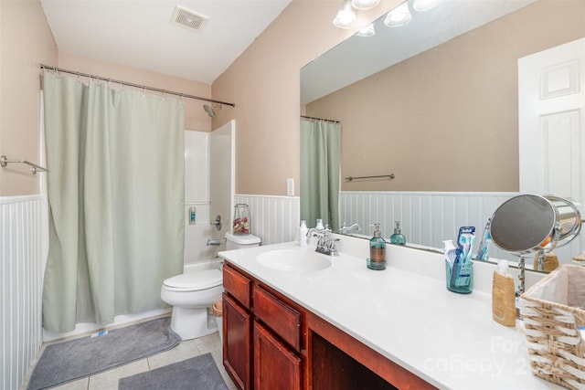 full bathroom with tile patterned flooring, vanity, toilet, and shower / bath combo with shower curtain