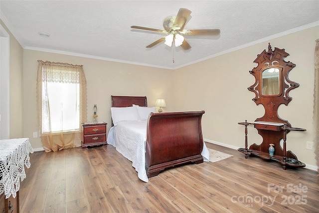 bedroom with wood-type flooring, crown molding, and a textured ceiling