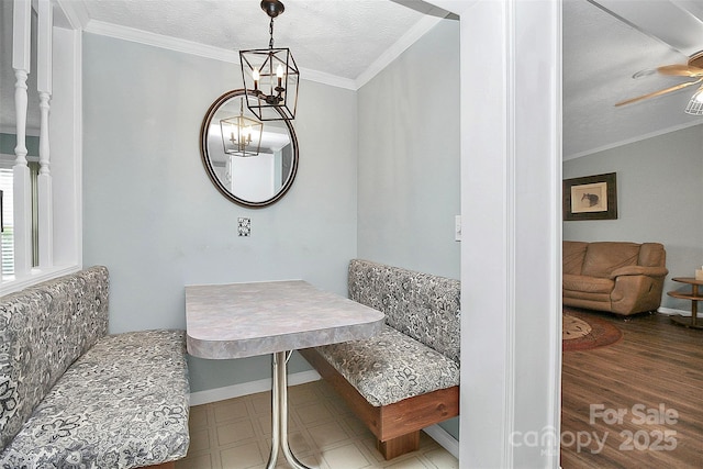 dining room with breakfast area, crown molding, a textured ceiling, and tile patterned floors