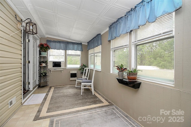 sunroom / solarium featuring heating unit, an ornate ceiling, visible vents, and cooling unit