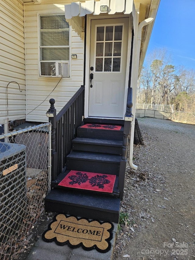 property entrance with fence