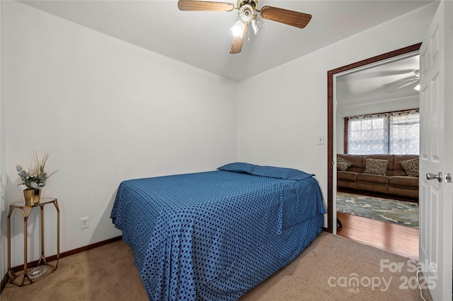 carpeted bedroom featuring ceiling fan