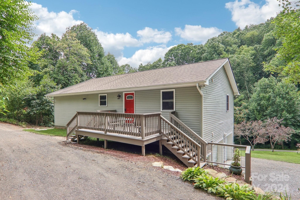 ranch-style house with a wooden deck