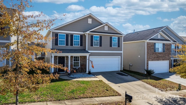 view of front facade with a garage and a front lawn