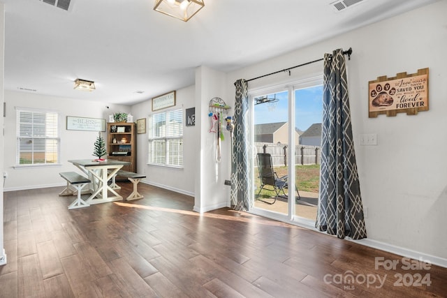 dining room with dark hardwood / wood-style flooring