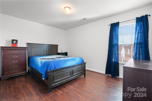 bedroom featuring dark wood-type flooring