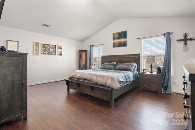 bedroom featuring dark hardwood / wood-style flooring and vaulted ceiling