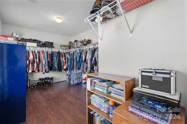 spacious closet with dark hardwood / wood-style floors