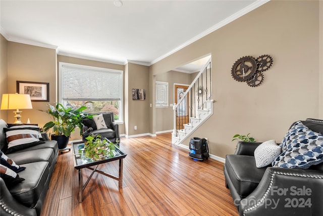 living room featuring wood-type flooring and ornamental molding