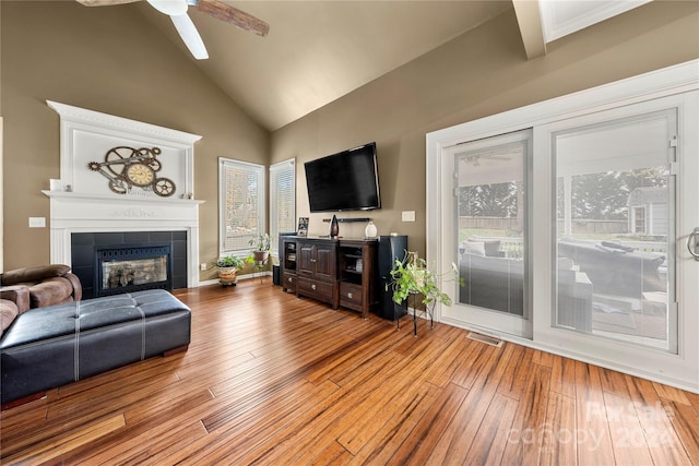 living room with light hardwood / wood-style floors, plenty of natural light, and ceiling fan