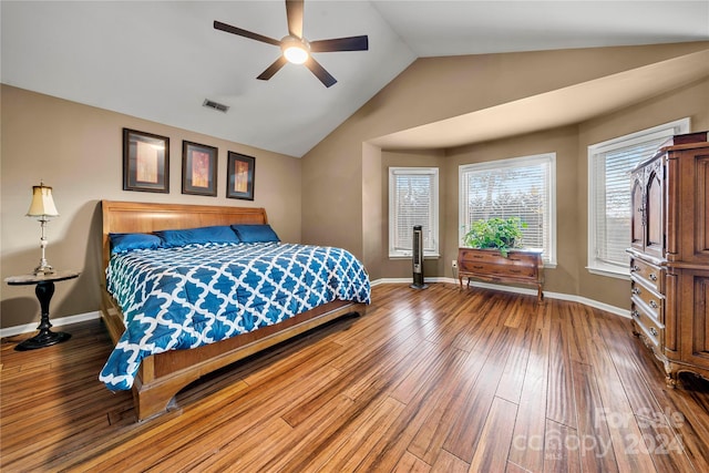 bedroom with hardwood / wood-style floors, ceiling fan, and lofted ceiling