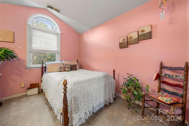 carpeted bedroom featuring vaulted ceiling